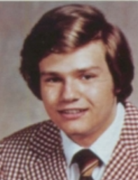 Yearbook portrait of George Poulos